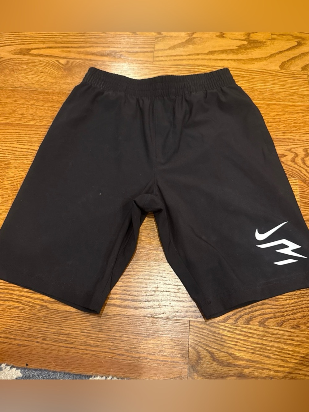 Nike Boys Black Athletic Shorts with White Logo